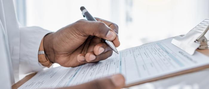 Patient filling out insurance paperwork.