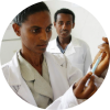 A nurse preparing a measles vaccine at a clinic.
