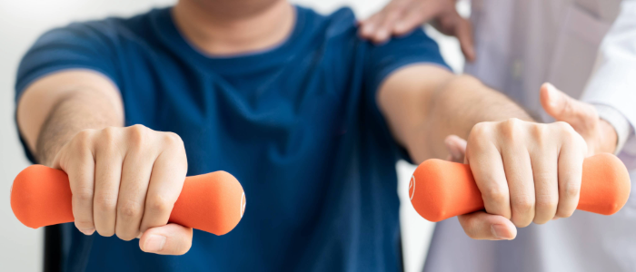Person lifting light weights after bariatric surgery as part of a healthy recovery plan