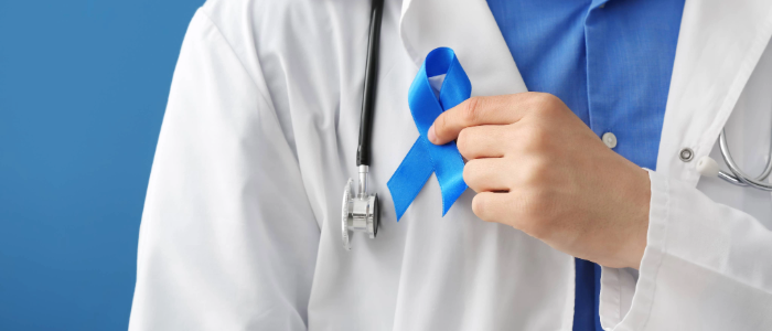 Doctor with blue ribbon representing colon cancer awareness