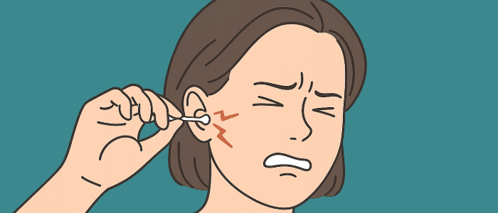 woman accidentally poking her eardrum with a Q tip.