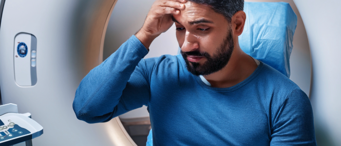 patient with a migraine getting an MRI to figure out the cause of his symptom.