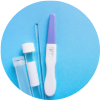 Pregnancy test strip next to collection tube and swab on blue surface.